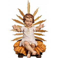 Niño Jesús vestido IHS sentado en cuna con aureola