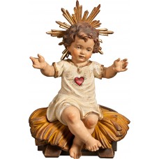 Niño Jesús vestido con Corazón sentado en cuna 7 cm Antiguo